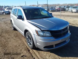 2017 Dodge Journey SE z VIN 3C4PDCAB3HT707273, wystawiony jako IAAI lot #41698208 z przebiegiem 143 053 mil mil oraz . Historia ofert i sprzedaży dostępna na DreamBid. Obrazek 1.