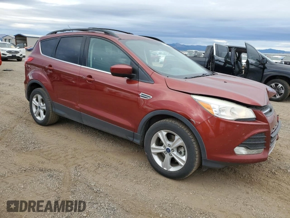 2015 Ford Escape SE with VIN 1FMCU9GX6FUC67715, listed as a Copart auction lot 73495244 with 184,183 mi miles and Salvage Title. Bid and sale history available at DreamBid. Image 4.