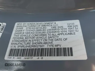 2024 Honda Odyssey Touring with VIN 5FNRL6H82RB027601, listed as a IAAI auction lot 41808680 with 25,911 mi miles and . Bid and sale history available at DreamBid. Image 9.