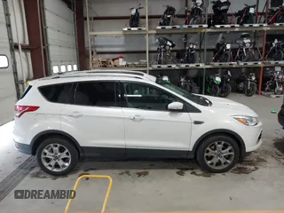 2014 Ford Escape Titanium with VIN 1FMCU9J91EUD43432, listed as a IAAI auction lot 40989177 with 110,383 mi miles and . Bid and sale history available at DreamBid. Image 13.