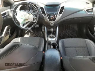 2016 Hyundai Veloster z VIN KMHTC6ADXGU270540, wystawiony jako Copart lot #54575165 z przebiegiem 122 606 mil mil oraz Szkody całkowita. Historia ofert i sprzedaży dostępna na DreamBid. Obrazek 8.