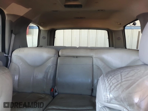 2001 GMC Yukon SLT z VIN 1GKEK13T21J165558, wystawiony jako Copart lot #52200565 z przebiegiem 291 699 mil mil oraz Szkoda całkowita • Salvage title. Historia ofert i sprzedaży dostępna na DreamBid. Obrazek 10.