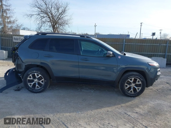 2014 Jeep Cherokee Trailhawk z VIN 1C4PJMBS5EW147579, wystawiony jako IAAI lot #41781543 z przebiegiem 155 751 mil mil oraz . Historia ofert i sprzedaży dostępna na DreamBid. Obrazek 14.