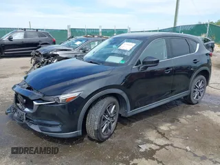 2018 Mazda CX-5 Grand Touring z VIN JM3KFBDM5J0307785, wystawiony jako IAAI lot #42302609 z przebiegiem 81 974 mil mil oraz . Historia ofert i sprzedaży dostępna na DreamBid. Obrazek 2.