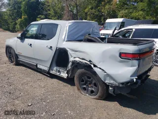2023 Rivian R1T Adventure with VIN 7FCTGAAA1PN019038, listed as a Copart auction lot 80917644 with 2,917 mi miles and Salvage Title. Bid and sale history available at carsss.com. Image 2.