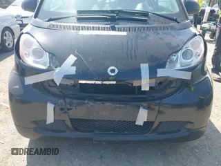 2012 Smart fortwo Pure z VIN WMEEJ3BAXCK526477, wystawiony jako IAAI lot #42392611 z przebiegiem 143 378 mil mil oraz . Historia ofert i sprzedaży dostępna na DreamBid. Obrazek 6.