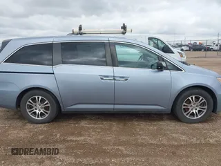 2011 Honda Odyssey EX-L with VIN 5FNRL5H64BB085479, listed as a IAAI auction lot 42404637 with 185,624 mi miles and . Bid and sale history available at DreamBid. Image 13.