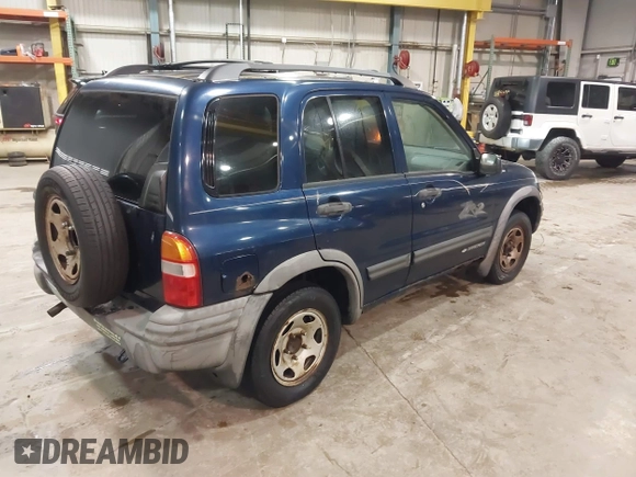 2003 Chevrolet Tracker ZR2 z VIN 2CNBJ734736905310, wystawiony jako IAAI lot #41519431 z przebiegiem 177 643 mil mil oraz . Historia ofert i sprzedaży dostępna na DreamBid. Obrazek 4.