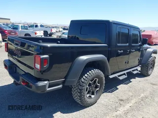 2023 Jeep Gladiator Rubicon z VIN 1C6JJTBG3PL531982, wystawiony jako IAAI lot #42211139 z przebiegiem 28 301 mil mil oraz . Historia ofert i sprzedaży dostępna na DreamBid. Obrazek 4.