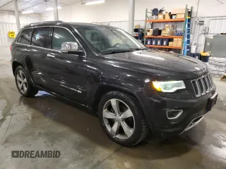 2015 Jeep Grand Cherokee Overland with VIN 1C4RJFCG7FC911899, listed as a Copart auction lot 54123925 with 243,031 mi miles and Salvage Title. Bid and sale history available at carsss.com. Image 4.
