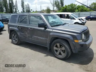 2014 Jeep Patriot High Altitude with VIN 1C4NJPFA2ED888925, listed as a Copart auction lot 60191435 with 122,308 mi miles and Salvage title. Bid and sale history available at DreamBid. Image 4.
