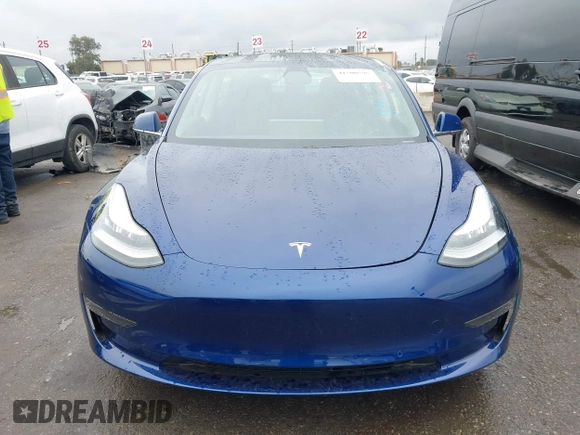 2020 Tesla Model 3 Standard Range Plus with VIN 5YJ3E1EAXLF644679, listed as a IAAI auction lot 41500595 with 53,726 mi miles and . Bid and sale history available at DreamBid. Image 12.