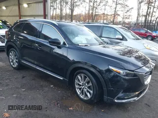 2018 Mazda CX-9 Grand Touring with VIN JM3TCBDY1J0226816, listed as a IAAI auction lot 41090655 with 99,320 mi miles and . Bid and sale history available at DreamBid. Image 1.