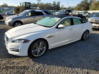 2016 Jaguar XJ with VIN SAJWA1CE4GMV91734, listed as a Copart auction lot 81005144 with 31,924 mi miles and Salvage Title. Bid and sale history available at DreamBid. Image 1.