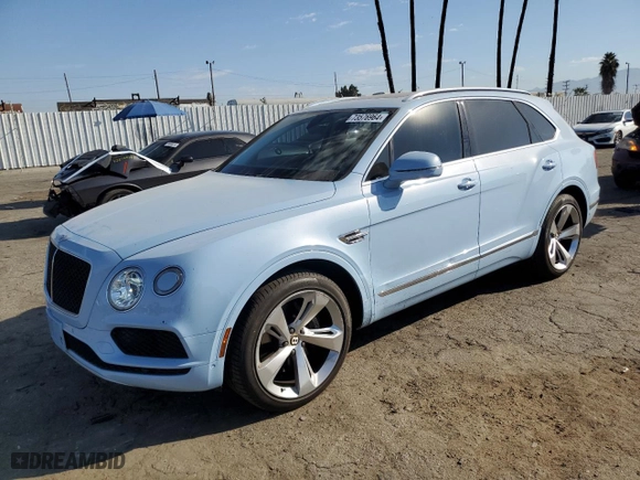2019 Bentley Bentayga V8 with VIN SJAAM2ZV9KC026988, listed as a Copart auction lot 73576964 with 31162 miles and Salvage Title. Bid and sale history available at carsss.com. Image 1.