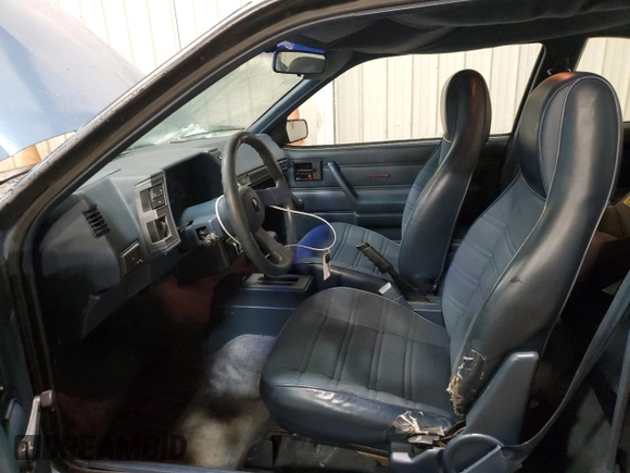1989 Chevrolet Cavalier with VIN 1G1JC1113KJ278292, listed as a Copart auction lot 44942375 with 85,604 mi miles and Salvage Title. Bid and sale history available at DreamBid. Image 7.