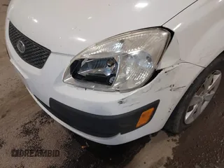 2009 Kia Rio SX with VIN KNADE223896533839, listed as a IAAI auction lot 41328220 with 140,968 mi miles. Bid and sale history available at carsss.com. Image 6.