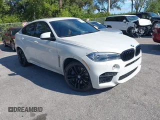 2019 BMW X6 M with VIN 5YMKW8C50K0Y75148, listed as a IAAI auction lot 41244301 with 57,875 mi miles. Bid and sale history available at carsss.com. Image 1.