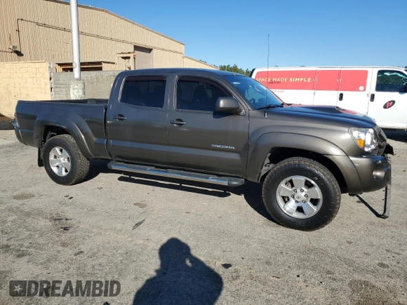 2010 Toyota Tacoma PreRunner with VIN 3TMKU4HN3AM025218, listed as a Copart auction lot 87600035 with 92,605 mi miles and Salvage title. Bid and sale history available at DreamBid. Image 4.