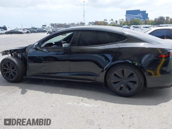 2023 Tesla Model S with VIN 5YJSA1E52PF528795, listed as a IAAI auction lot 42110660 with 21,243 mi miles and . Bid and sale history available at DreamBid. Image 14.