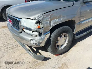 2003 GMC Yukon SLT with VIN 1GKEC13V33R298333, listed as a IAAI auction lot 41582447 with 166,047 mi miles. Bid and sale history available at carsss.com. Image 6.