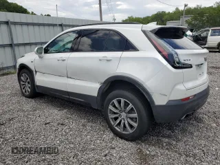2019 Cadillac XT4 FWD Sport with VIN 1GYFZER44KF210582, listed as a Copart auction lot 61272015 with 104,073 mi miles and Salvage title. Bid and sale history available at DreamBid. Image 2.