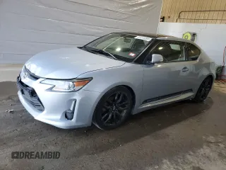2014 Scion tC z VIN JTKJF5C71E3075121, wystawiony jako Copart lot #51273265 z przebiegiem 138 730 mil mil oraz Szkody całkowita. Historia ofert i sprzedaży dostępna na DreamBid. Obrazek 1.