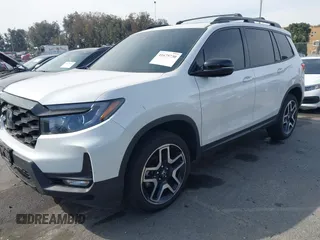 2023 Honda Passport Elite with VIN 5FNYF8H07PB010220, listed as a IAAI auction lot 41675730 with 25,128 mi miles and . Bid and sale history available at DreamBid. Image 6.