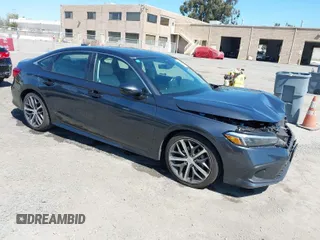 2023 Honda Civic Sedan Touring with VIN 2HGFE1F91PH310656, listed as a IAAI auction lot 41884334 with 17,691 mi miles. Bid and sale history available at carsss.com. Image 1.