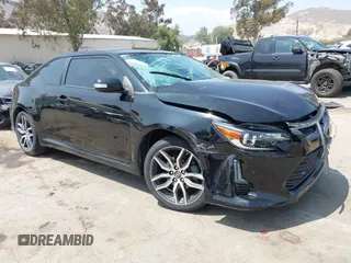 2015 Scion tC z VIN JTKJF5C77F3092989, wystawiony jako IAAI lot #42182242 z przebiegiem 119 685 mil mil oraz . Historia ofert i sprzedaży dostępna na DreamBid. Obrazek 1.
