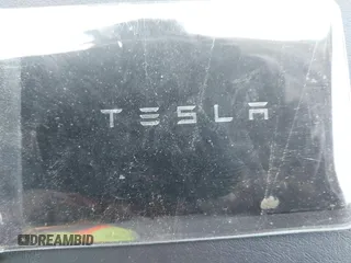 2023 Tesla Model Y Long Range with VIN 7SAYGAEE7PF615751, listed as a IAAI auction lot 42297819 with 31,201 mi miles and . Bid and sale history available at DreamBid. Image 11.