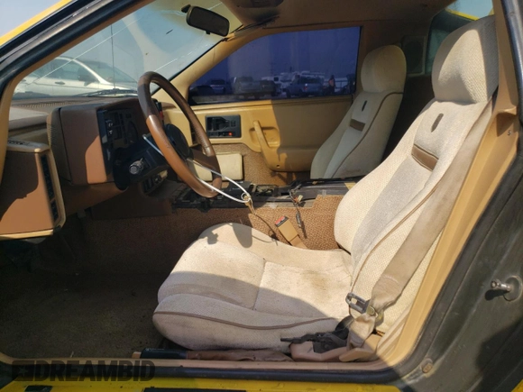 1986 Pontiac Fiero z VIN 1G2PG9796GP256622, wystawiony jako Copart lot #69203894 z przebiegiem 38 964 mil mil oraz Szkody całkowita. Historia ofert i sprzedaży dostępna na DreamBid. Obrazek 7.