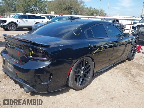 2019 Dodge Charger R/T with VIN 2C3CDXCT2KH575297, listed as a IAAI auction lot 41661339 with 119,854 mi miles and . Bid and sale history available at DreamBid. Image 4.