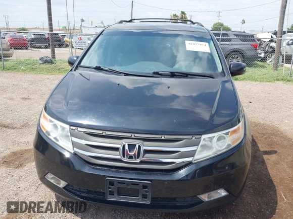2013 Honda Odyssey Touring with VIN 5FNRL5H95DB086041, listed as a IAAI auction lot 42477974 with 213,343 mi miles and . Bid and sale history available at DreamBid. Image 6.
