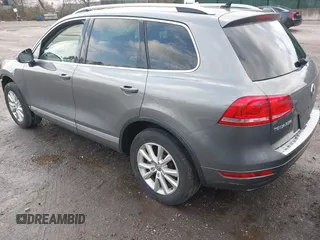 2013 Volkswagen Touareg Lux with VIN WVGEF9BPXDD000679, listed as a IAAI auction lot 41956471 with 117,465 mi miles and . Bid and sale history available at DreamBid. Image 3.