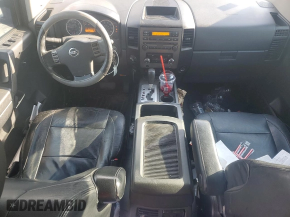 2010 Nissan Titan LE with VIN 1N6BA0EC6AN320790, listed as a Copart auction lot 52613495 with 224,118 mi miles and Salvage Title. Bid and sale history available at carsss.com. Image 8.