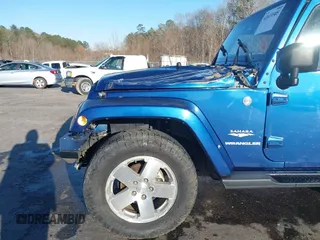 2009 Jeep Wrangler Sahara z VIN 1J4FA54199L722192, wystawiony jako IAAI lot #41619305 z przebiegiem 105 545 mil mil oraz . Historia ofert i sprzedaży dostępna na DreamBid. Obrazek 6.
