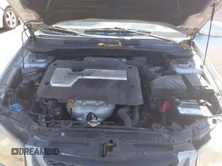 2005 Kia Spectra LX with VIN KNAFE121955107403, listed as a IAAI auction lot 42055036 with 157,605 mi miles. Bid and sale history available at carsss.com. Image 10.