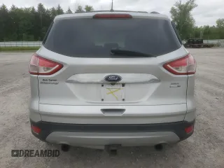 2013 Ford Escape SEL z VIN 1FMCU9H9XDUD00146, wystawiony jako Copart lot #60886165 z przebiegiem 198 557 mil mil oraz Szkoda całkowita • Salvage title. Historia ofert i sprzedaży dostępna na DreamBid. Obrazek 6.