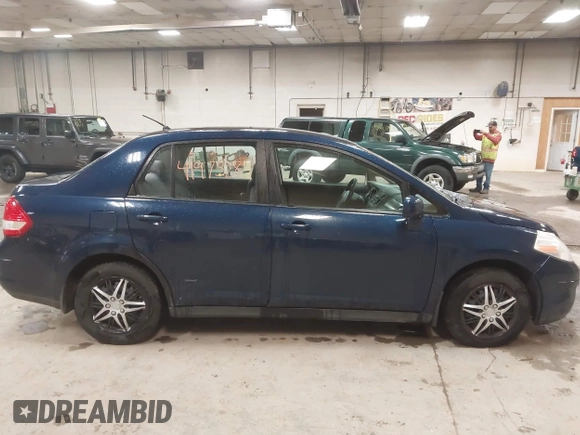 2009 Nissan Versa 1.8 S with VIN 3N1BC11E79L440560, listed as a IAAI auction lot 41975289 with 158,726 mi miles. Bid and sale history available at carsss.com. Image 14.