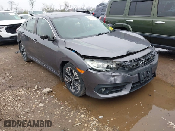 2017 Honda Civic EX-T with VIN 19XFC1F34HE014334, listed as a IAAI auction lot 42009311 with 124,717 mi miles. Bid and sale history available at carsss.com. Image 1.