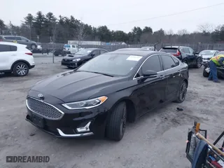 2020 Ford Fusion Hybrid Titanium with VIN 3FA6P0RU7LR141332, listed as a IAAI auction lot 40994365 with 106,592 mi miles. Bid and sale history available at carsss.com. Image 18.