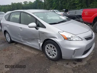 2014 Toyota Prius Two z VIN JTDZN3EU0EJ009210, wystawiony jako IAAI lot #42411066 z przebiegiem 124 588 mil mil oraz . Historia ofert i sprzedaży dostępna na DreamBid. Obrazek 1.
