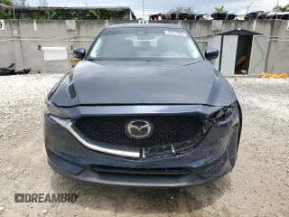 2021 Mazda CX-5 Grand Touring z VIN JM3KFBDM5M0464611, wystawiony jako Copart lot #62829065 z przebiegiem 20 525 mil mil oraz Nie do naprawy • Non repairable. Historia ofert i sprzedaży dostępna na DreamBid. Obrazek 5.