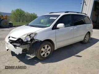2010 Toyota Sienna XLE with VIN 5TDYK4CC8AS290058, listed as a Copart auction lot 54402975 with 210,996 mi miles and Salvage title. Bid and sale history available at DreamBid. Image 1.