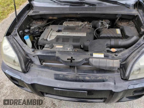 2005 Hyundai Tucson GL with VIN KM8JM12BX5U071182, listed as a Copart auction lot 74852974 with 74,235 mi miles and Salvage Title. Bid and sale history available at carsss.com. Image 12.