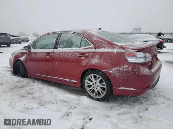 2010 Lexus HS 250h with VIN JTHBB1BA9A2005121, listed as a Copart auction lot 87825175 with 124,594 mi miles and Salvage Title. Bid and sale history available at DreamBid. Image 2.
