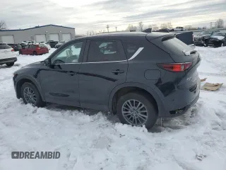 2019 Mazda CX-5 Touring with VIN JM3KFBCM0K0607933, listed as a Copart auction lot 46260815 with 64,349 mi miles and Salvage Title. Bid and sale history available at carsss.com. Image 2.
