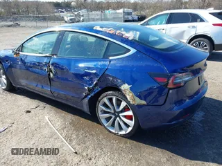 2018 Tesla Model 3 Long Range Battery z VIN 5YJ3E1EB5JF180030, wystawiony jako IAAI lot #41897617 z przebiegiem 89 557 mil mil oraz . Historia ofert i sprzedaży dostępna na DreamBid. Obrazek 3.