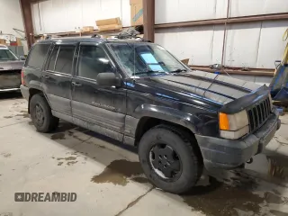 1998 Jeep Grand Cherokee Laredo with VIN 1J4GZ58Y9WC122076, listed as a Copart auction lot 84221784 with 387,353 mi miles and Salvage Title. Bid and sale history available at carsss.com. Image 4.